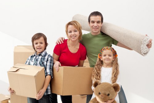 Staff using proper lifting technique during a move