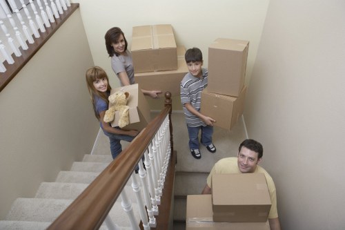 Careful unloading of household items at a Fitzrovia same day removals destination